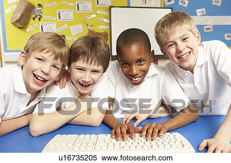 Stock Photography - Schoolchildren in IT Class Using Computers. Fotosearch
