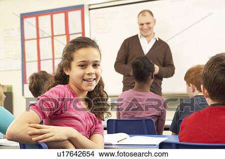 Schoolchildren Studying In Classroom With Teacher View Large Photo Image Picture - Schoolchildren Studying In Classroom With Teacher. Fotosearch