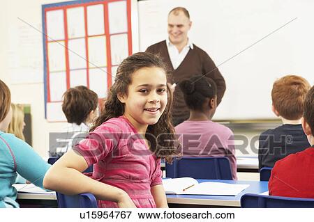 Schoolchildren Studying In Classroom With Teacher View Large Photo Image Stock Photo - Schoolchildren Studying In Classroom With Teacher. Fotosearch