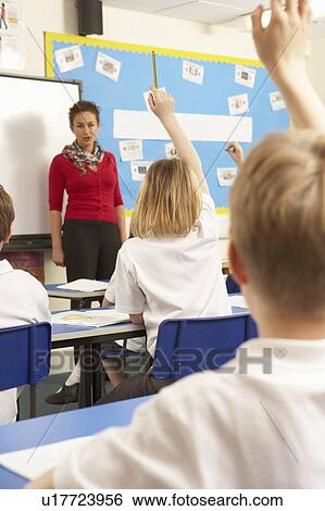 Schoolchildren Studying In Classroom With Teacher View Large Photo Image Stock Photograph - Schoolchildren Studying In Classroom With Teacher. Fotosearch