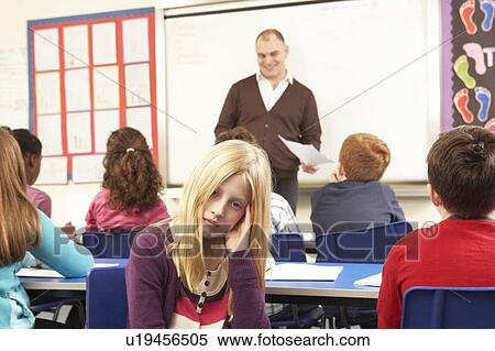 Stock Photography - Schoolchildren Studying In Classroom With Teacher. Fotosearch
