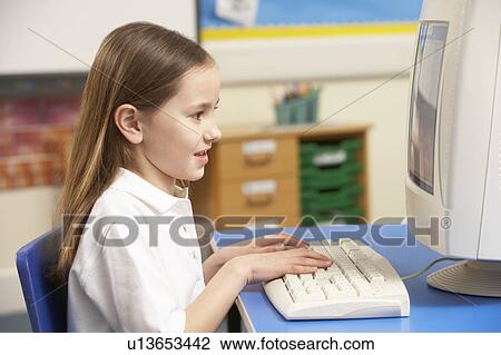 Schoolgirl In IT Class Using Computer View Large Photo Image Stock Image - Schoolgirl In IT Class Using Computer. Fotosearch