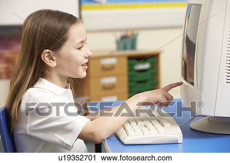 Schoolgirl In IT Class Using Computer View Large Photo Image Stock Image - Schoolgirl In IT Class Using Computer. Fotosearch