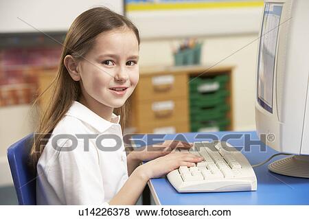Schoolgirl In IT Class Using Computer View Large Photo Image Stock Photo - Schoolgirl In IT Class Using Computer. Fotosearch