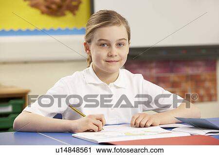 Schoolgirl Studying In Classroom View Large Photo Image Stock Image - Schoolgirl Studying In Classroom. Fotosearch