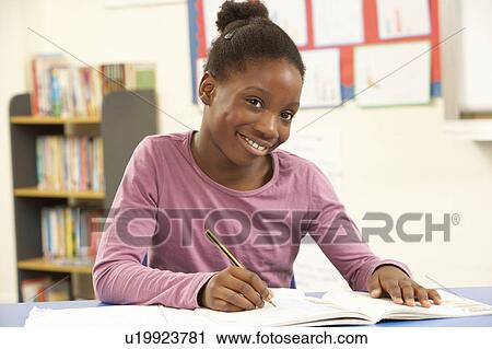 Schoolgirl Studying In Classroom View Large Photo Image Stock Image - Schoolgirl Studying In Classroom. Fotosearch