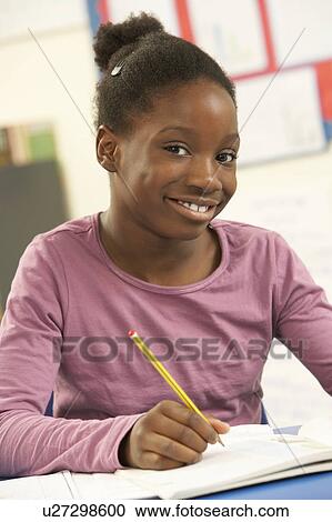 Schoolgirl Studying In Classroom View Large Photo Image Stock Image - Schoolgirl Studying In Classroom. Fotosearch