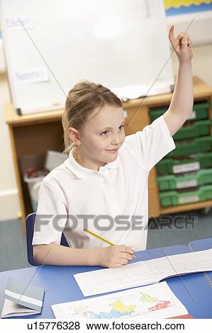 Stock Photo - Schoolgirl Studying In Classroom. Fotosearch