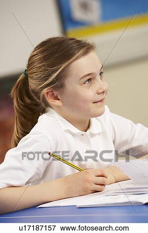 Stock Photo - Schoolgirl Studying In Classroom. Fotosearch