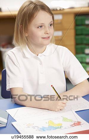 Schoolgirl Studying In Classroom View Large Photo Image Stock Photo - Schoolgirl Studying In Classroom. Fotosearch