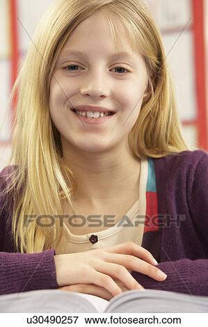 Schoolgirl Studying In Classroom View Large Photo Image Stock Photo - Schoolgirl Studying In Classroom. Fotosearch