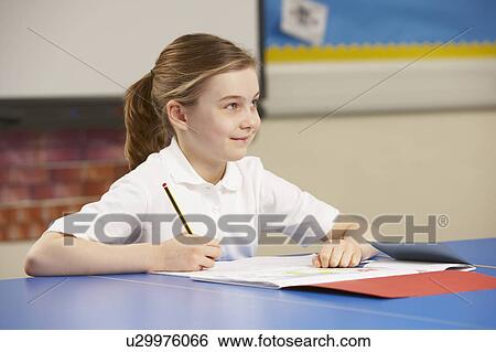 Schoolgirl Studying In Classroom View Large Photo Image Stock Photograph - Schoolgirl Studying In Classroom. Fotosearch