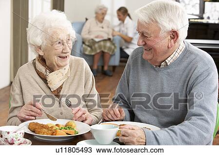 Senior Couple Enjoying Meal Together View Large Photo Image Stock Image - Senior Couple Enjoying Meal Together. Fotosearch