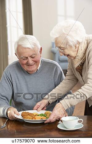 Senior Couple Enjoying Meal Together View Large Photo Image Stock Image - Senior Couple Enjoying Meal Together. Fotosearch