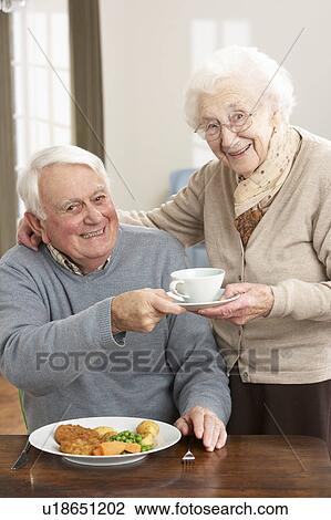 Senior Couple Enjoying Meal Together View Large Photo Image Stock Image - Senior Couple Enjoying Meal Together. Fotosearch