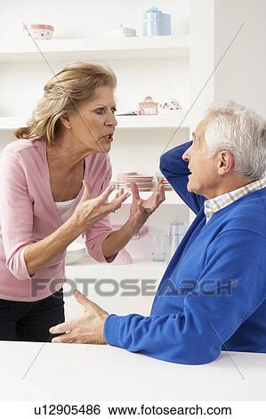 Stock Photograph - Senior Couple Having Argument At Home. Fotosearch