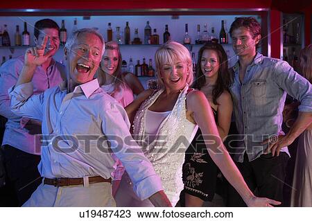 Senior Couple Having Fun In Busy Bar View Large Photo Image Stock Image - Senior Couple Having Fun In Busy Bar. Fotosearch