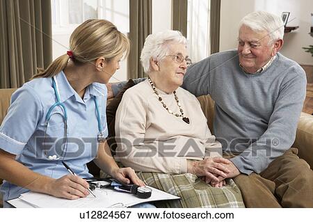 Senior Couple In Discussion With Health Visitor At Home View Large Photo Image Stock Photo - Senior Couple In Discussion With Health Visitor At Home. Fotosearch
