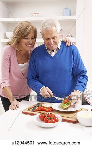 Senior Couple Making Sandwich In Kitchen View Large Photo Image Stock Image - Senior Couple Making Sandwich In Kitchen. Fotosearch