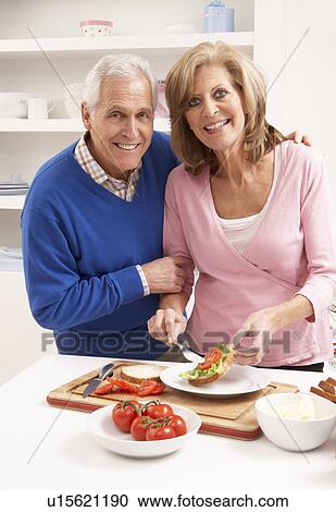 Senior Couple Making Sandwich In Kitchen View Large Photo Image Stock Image - Senior Couple Making Sandwich In Kitchen. Fotosearch