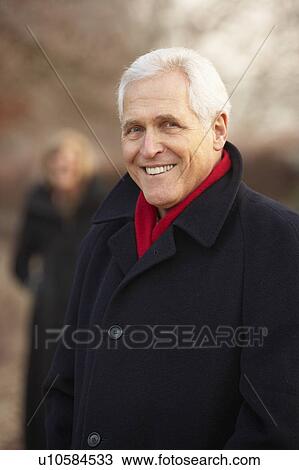 Senior Couple On Winter Walk Through Frosty Landscape View Large Photo Image Stock Image - Senior Couple On Winter Walk Through Frosty Landscape. Fotosearch