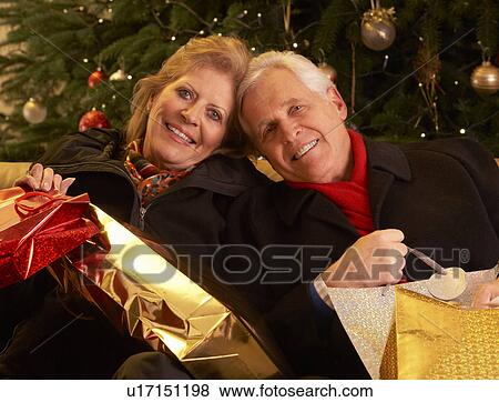 Senior Couple Returning After Christmas Shopping Trip View Large Photo Image Stock Photo - Senior Couple Returning After Christmas Shopping Trip. Fotosearch