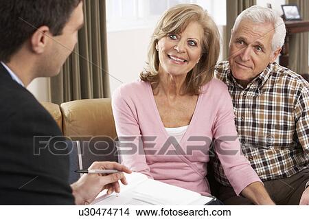 Picture - Senior Couple Talking With Financial Advisor. Fotosearch