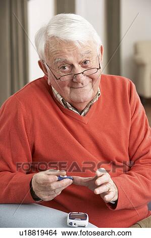 Senior Man Checking Blood Sugar Level At Home View Large Photo Image Picture - Senior Man Checking Blood Sugar Level At Home. Fotosearch