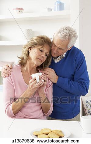 Stock Photo - Senior Man Consoling Wife. Fotosearch