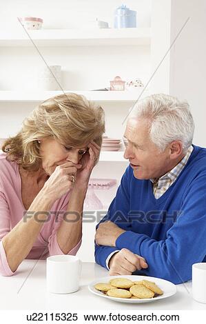 Stock Photography - Senior Man Consoling Wife. Fotosearch