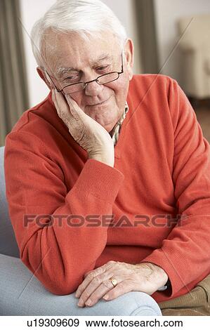 Senior Man Looking Sad In Chair At Home View Large Photo Image Stock Photo - Senior Man Looking Sad In Chair At Home. Fotosearch