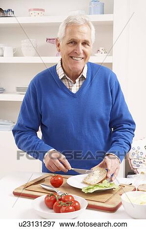 Senior Man Making Sandwich In Kitchen View Large Photo Image Stock Photo - Senior Man Making Sandwich In Kitchen. Fotosearch