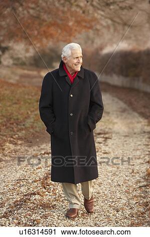 Senior Man On Winter Walk Through Frosty Landscape View Large Photo Image Stock Image - Senior Man On Winter Walk Through Frosty Landscape. Fotosearch