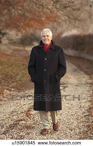 Senior Man On Winter Walk Through Frosty Landscape View Large Photo Image Stock Photography - Senior Man On Winter Walk Through Frosty Landscape. Fotosearch