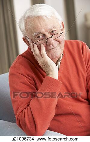 Senior Man Relaxing In Chair At Home View Large Photo Image Picture - Senior Man Relaxing In Chair At Home. Fotosearch