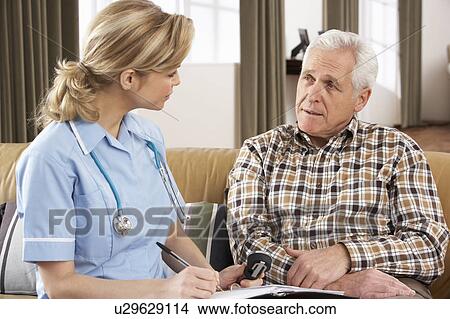 Senior Man Talking To Health Visitor At Home View Large Photo Image Picture - Senior Man Talking To Health Visitor At Home. Fotosearch