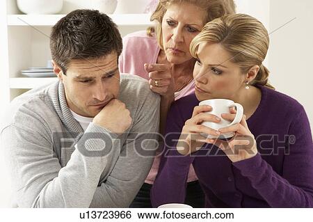 Senior Mother Interferring With Couple Having Argument At Home View Large Photo Image Stock Photograph - Senior Mother Interferring With Couple Having Argument At Home. Fotosearch