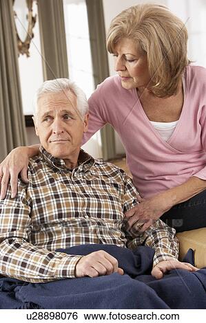 Senior Woman Caring For Sick Husband View Large Photo Image Stock Photograph - Senior Woman Caring For Sick Husband. Fotosearch