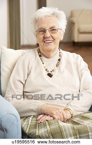 Senior Woman In Chair At Home View Large Photo Image Stock Photograph - Senior Woman In Chair At Home. Fotosearch
