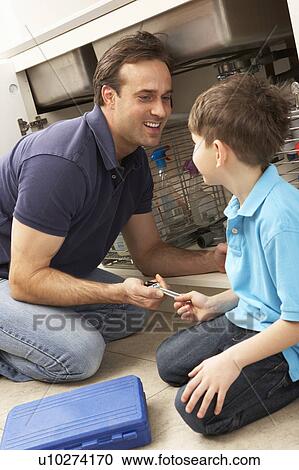 Son Helping Father To Mend Sink In Kitchen View Large Photo Image Stock Image - Son Helping Father To Mend Sink In Kitchen. Fotosearch