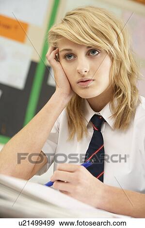Stressed Female Teenage Student Studying In Classroom View Large Photo Image Stock Photo - Stressed Female Teenage Student Studying In Classroom. Fotosearch