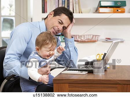 Stressed Man With Baby Working From Home Using Laptop View Large Photo Image Stock Image - Stressed Man With Baby Working From Home Using Laptop. Fotosearch