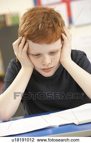 Stressed Schoolboy Studying In Classroom View Large Photo Image Stock Image - Stressed Schoolboy Studying In Classroom. Fotosearch