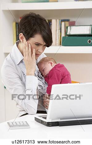 Stressed Woman With Newborn Baby Working From Home Using Laptop View Large Photo Image Stock Image - Stressed Woman With Newborn Baby Working From Home Using Laptop. Fotosearch