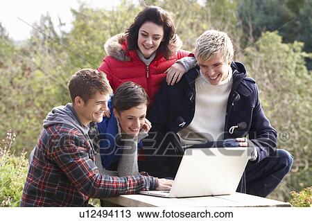 Stock Image - Students with laptop computer. Fotosearch