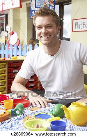 Picture - Teacher in nursery school. Fotosearch