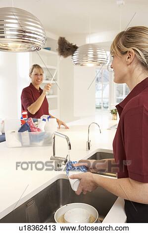 Team Of Commercial Cleaners Working In Domestic Kitchen View Large Photo Image Stock Image - Team Of Commercial Cleaners Working In Domestic Kitchen. Fotosearch