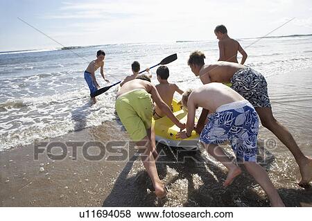 Teenage boys kayaking View Large Photo Image Stock Photo - Teenage boys kayaking. Fotosearch