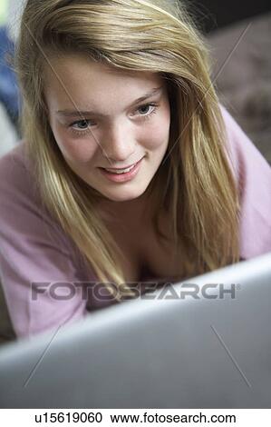 Teenage Girl Using Laptop At Home View Large Photo Image Stock Image - Teenage Girl Using Laptop At Home. Fotosearch