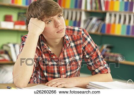Teenage Male Student In Working In Classroom View Large Photo Image Stock Photograph - Teenage Male Student In Working In Classroom. Fotosearch